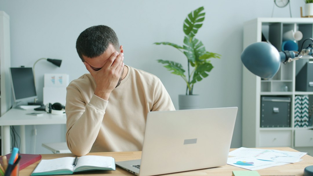 Frustrated business professional dealing with a computer problem